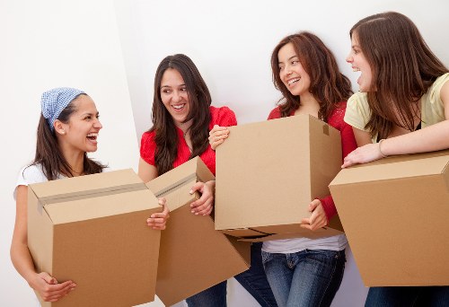 Charity donation boxes and reusable items set aside during a Roehampton move