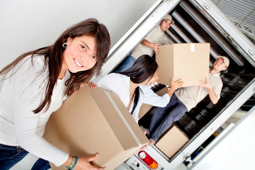 Local movers handling furniture and boxes near Roehampton residential streets