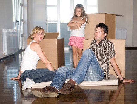 Professional movers loading household items for transport in Roehampton
