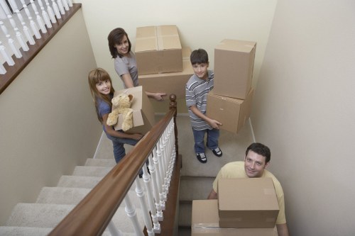 Local moving service transporting furniture in Roehampton
